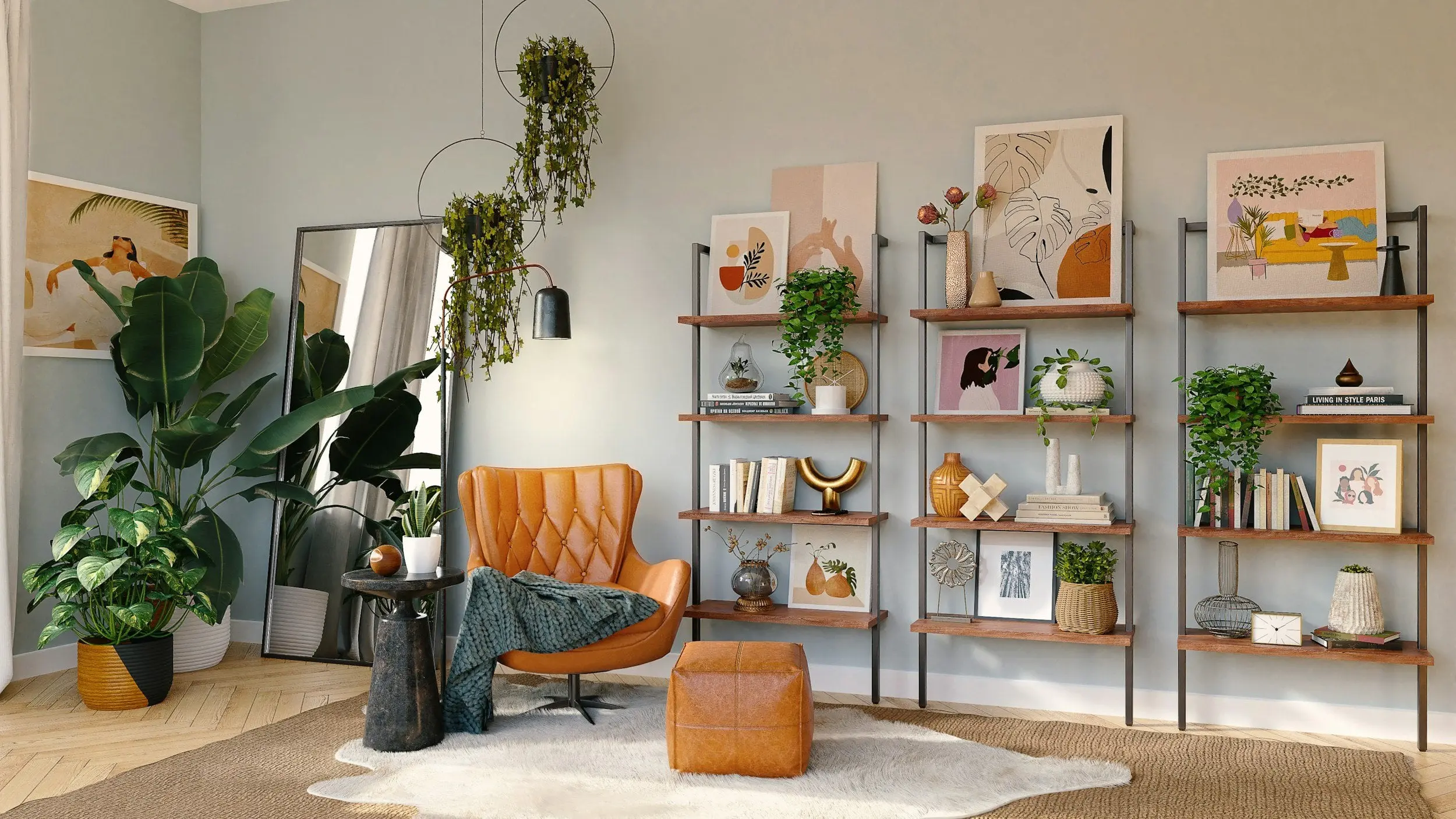 Styled reading corner with a caramel leather chair, decorative shelving, hanging greenery, and layered artwork in a warm residential interior.